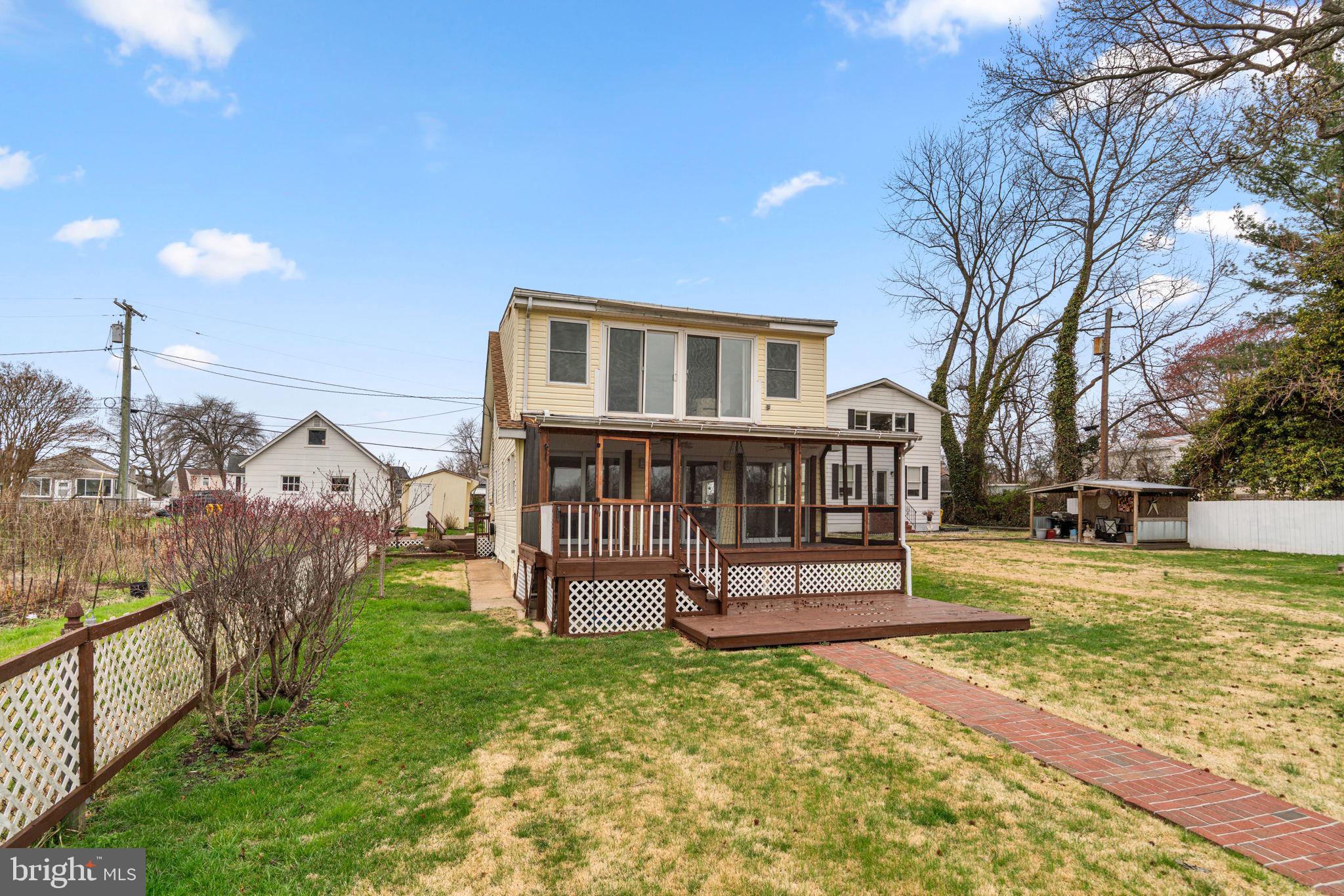 452 Carvel Beach Road Carvel Beach, MD 21226 - Photo 49 of 71 a view of a house with a yard and sitting area