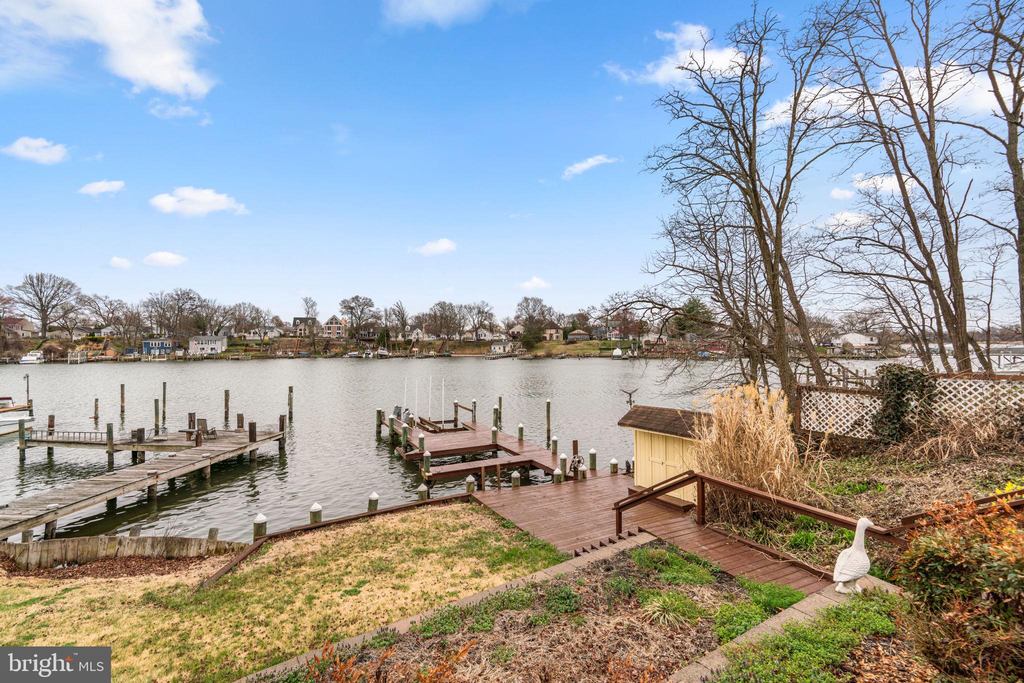 452 Carvel Beach Road Carvel Beach, MD 21226 - Photo 52 of 71 a view of a lake with houses in the back