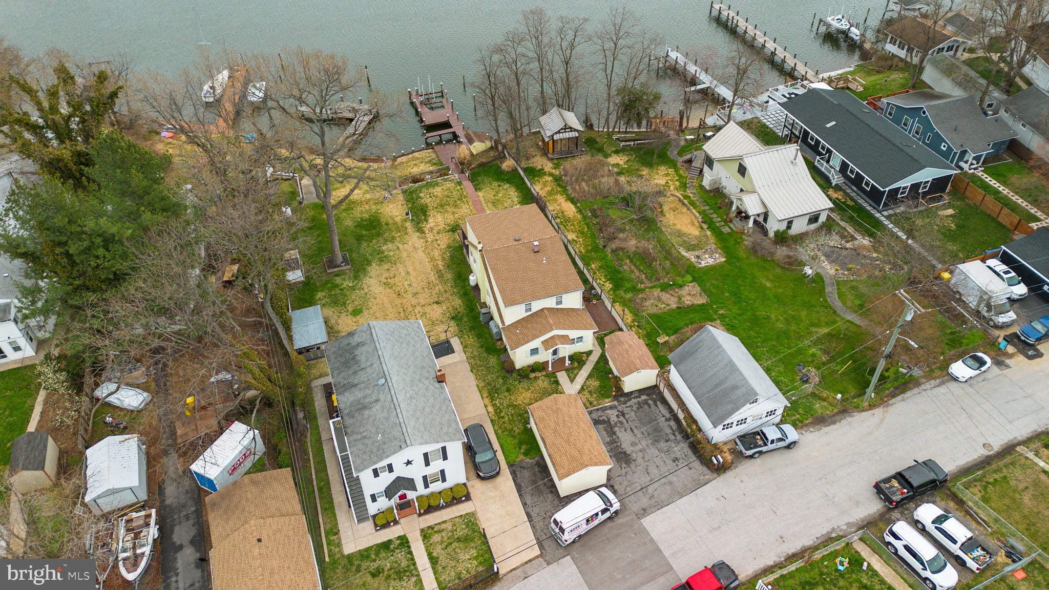 452 Carvel Beach Road Carvel Beach, MD 21226 - Photo 62 of 71 an aerial view of residential house with outdoor space and parking