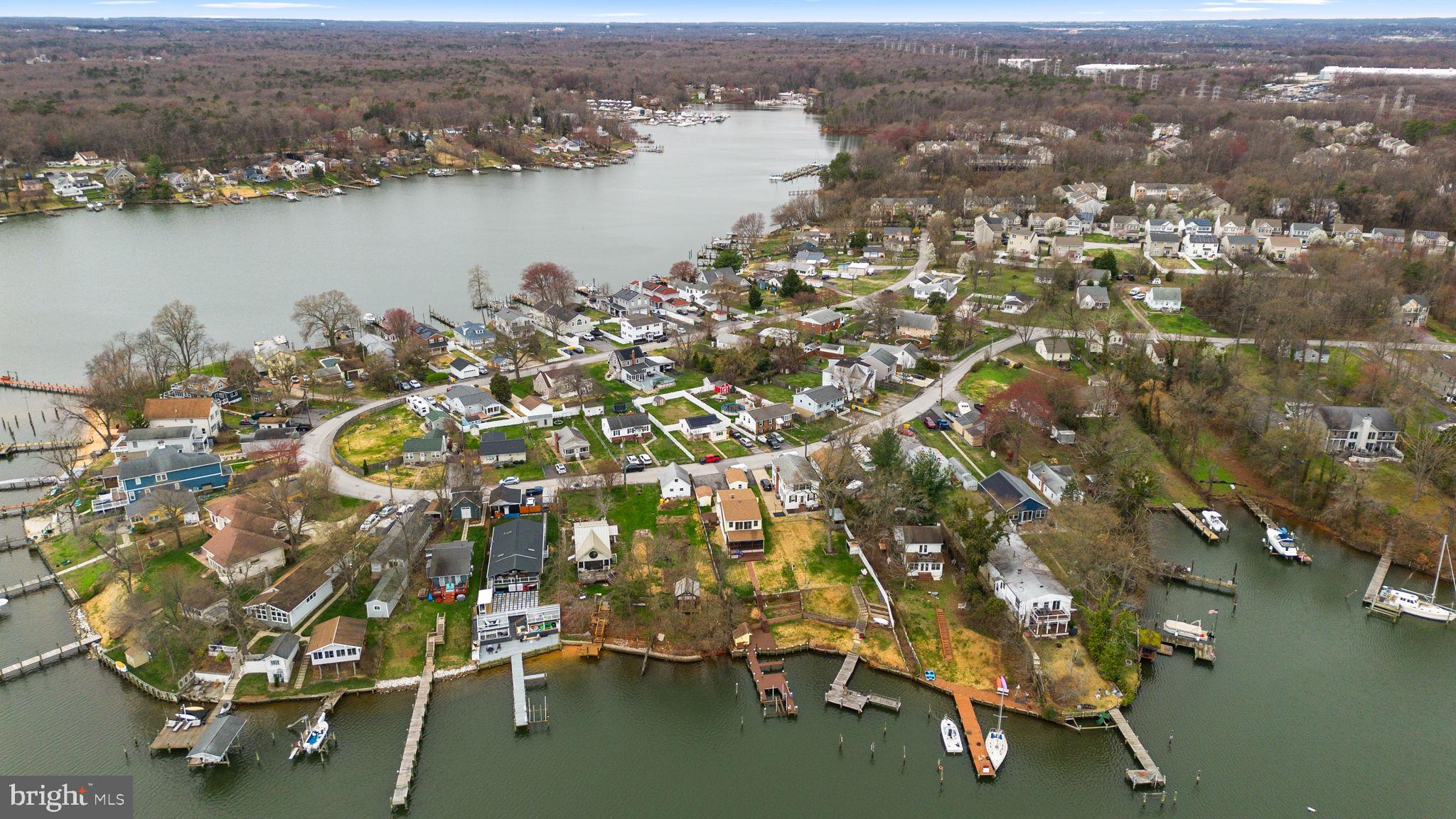 452 Carvel Beach Road Carvel Beach, MD 21226 - Photo 66 of 71 an aerial view of residential building with outdoor space and lake view