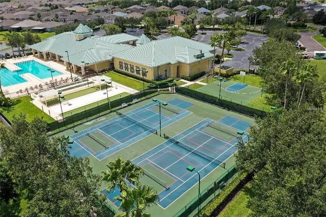 an aerial view of residential houses with outdoor space