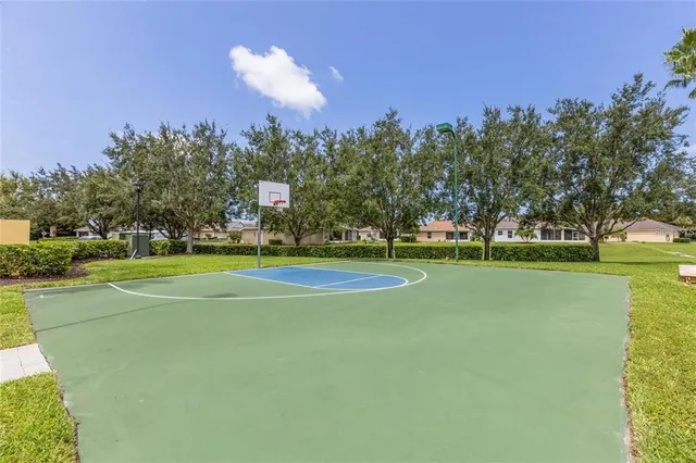a view of a playground with basketball court