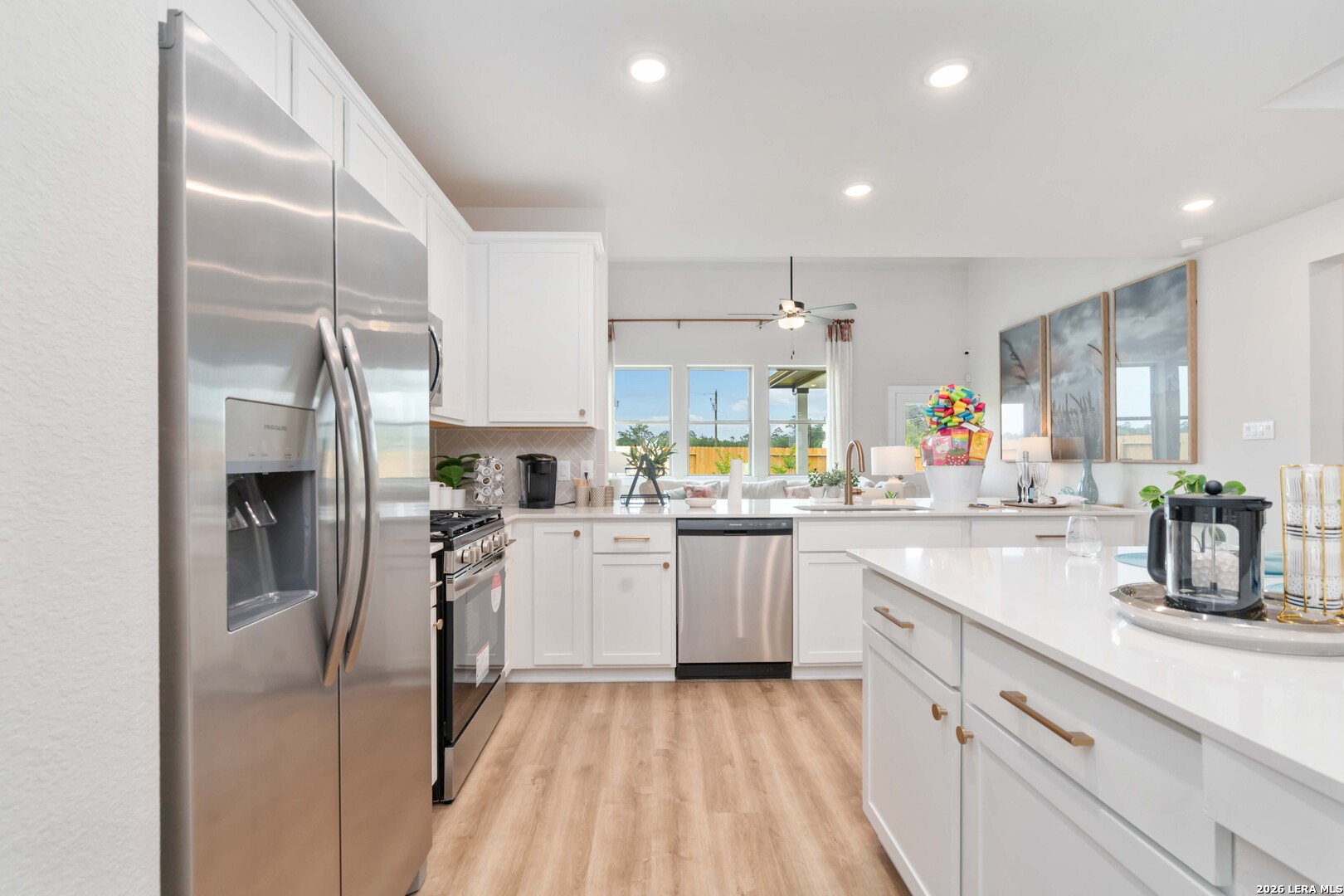 150 Ashley Loop San Antonio, TX 78253 - Photo 5 of 7 a kitchen with cabinets and stainless steel appliances