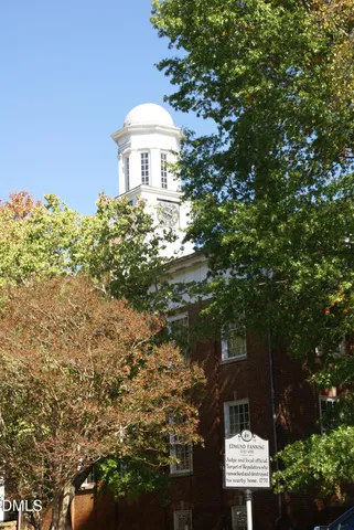 a view of a chairs and table in backyard