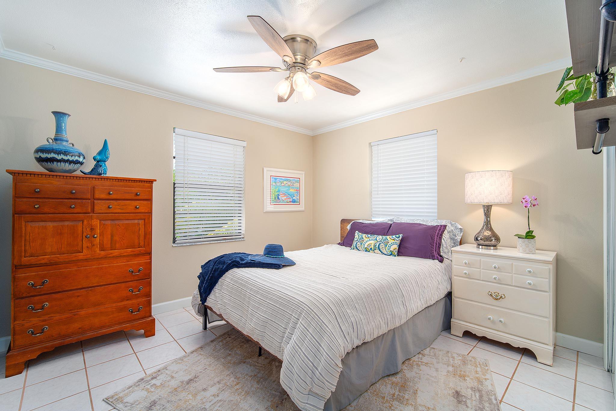 29827 Tropical Trader Road Big Pine Key, FL 33043 - Photo 15 of 32 a bedroom with a bed and a dresser