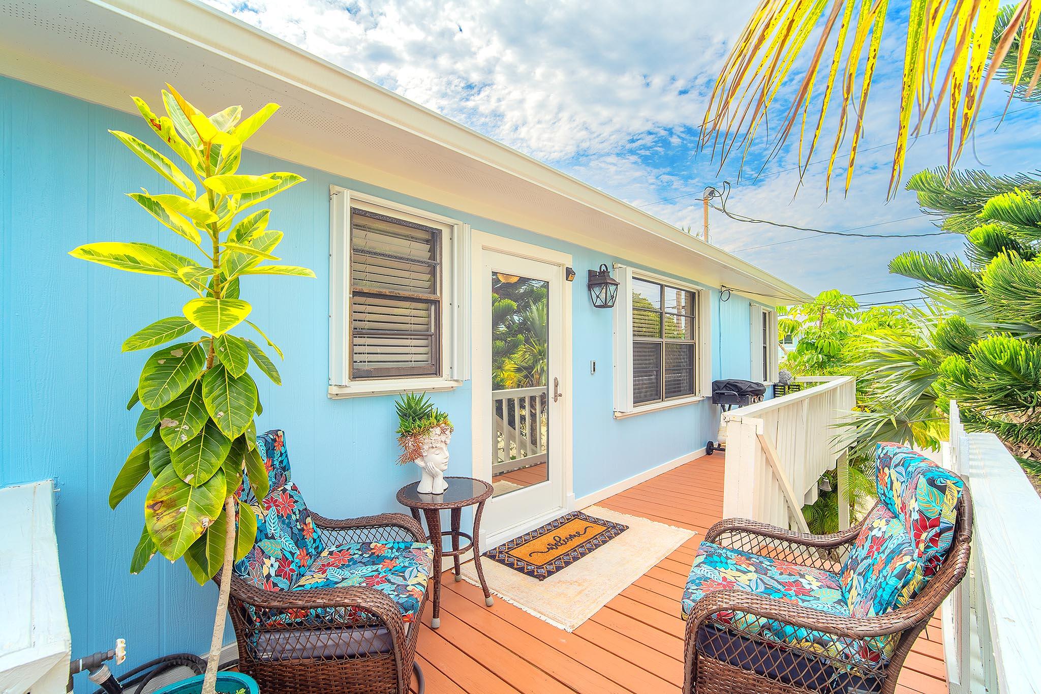 29827 Tropical Trader Road Big Pine Key, FL 33043 - Photo 2 of 32 a view of a dining room with furniture and a potted plant