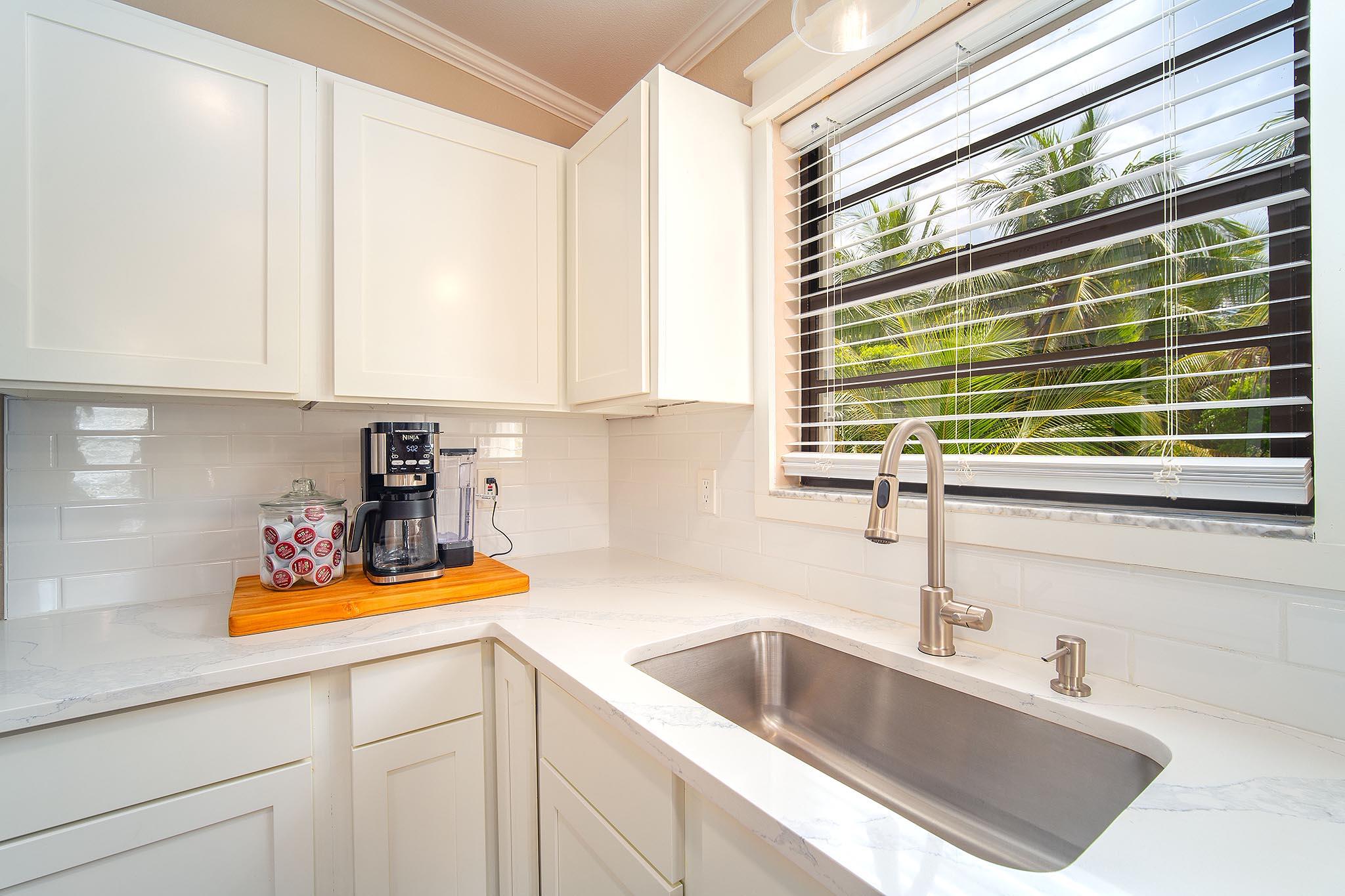 29827 Tropical Trader Road Big Pine Key, FL 33043 - Photo 9 of 32 a kitchen with a sink cabinets and a window