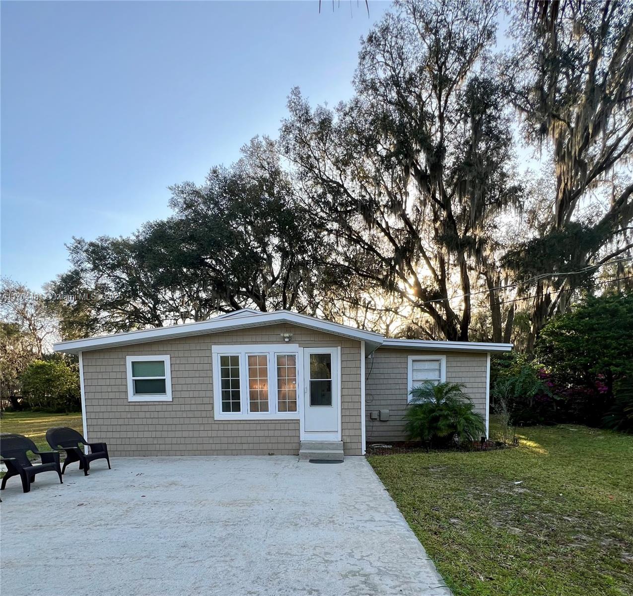 2985 Hilltop Road St. Augustine, FL 32086 - Photo 11 of 26 a view of a house with a backyard