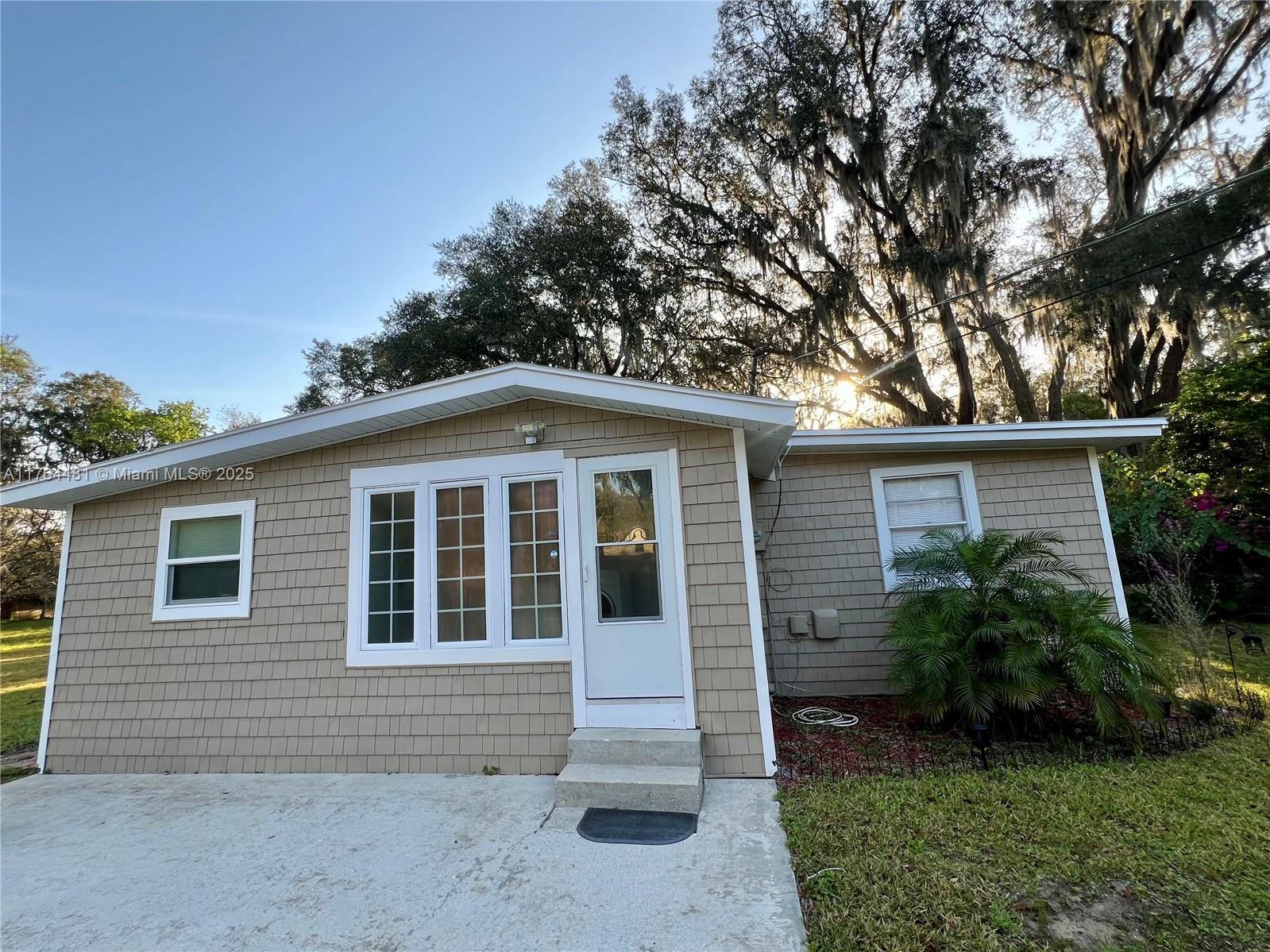 2985 Hilltop Road St. Augustine, FL 32086 - Photo 12 of 26 a front view of a house with garden