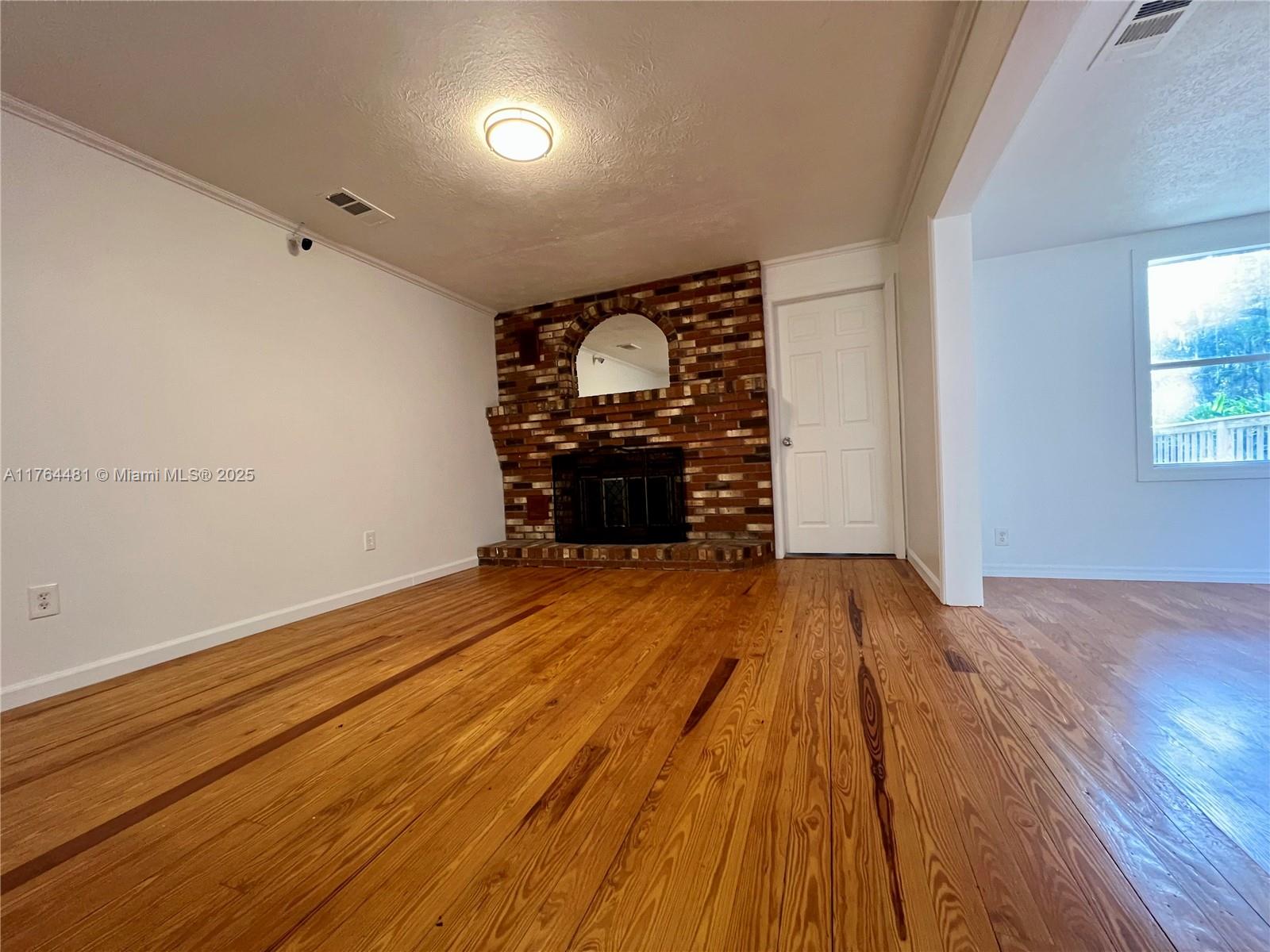 2985 Hilltop Road St. Augustine, FL 32086 - Photo 15 of 26 a view of empty room with wooden floor