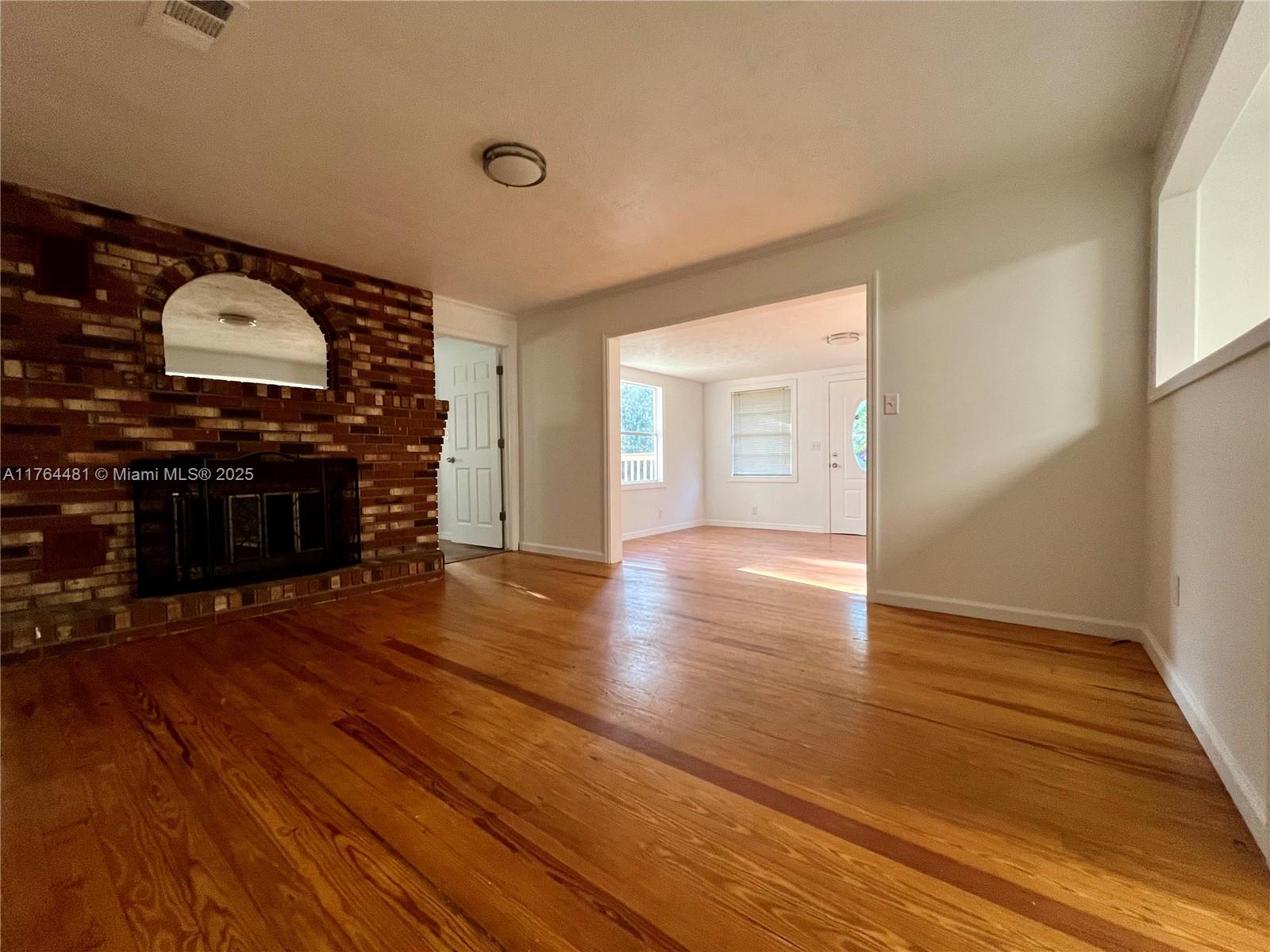 2985 Hilltop Road St. Augustine, FL 32086 - Photo 16 of 26 a view of a livingroom with wooden floor