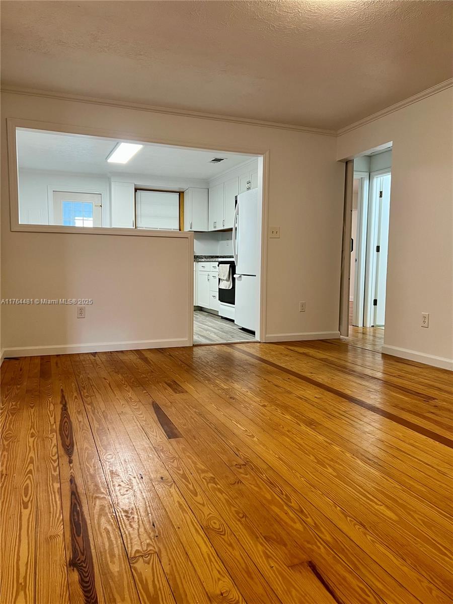 2985 Hilltop Road St. Augustine, FL 32086 - Photo 17 of 26 a view of empty room with wooden floor