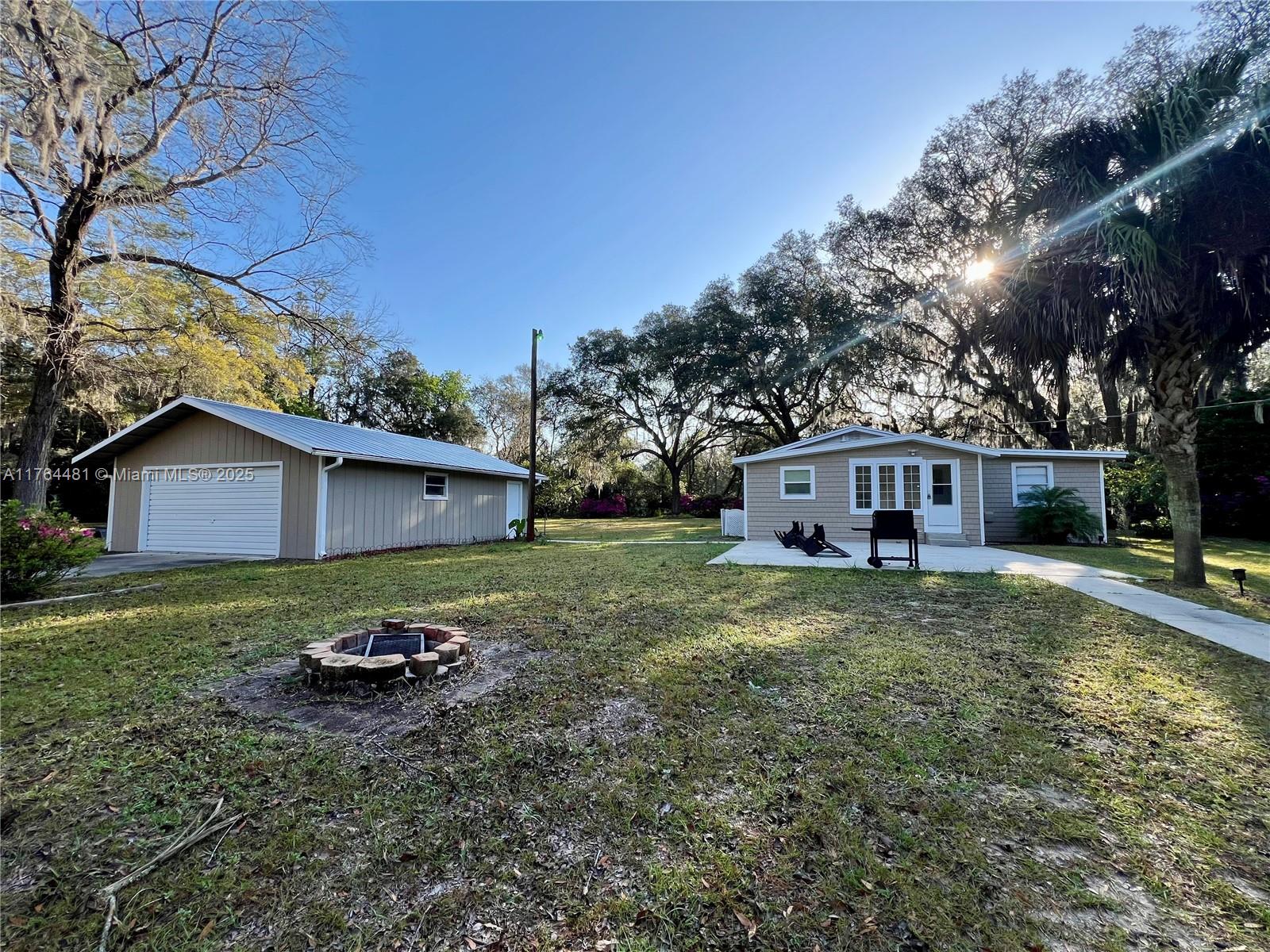 2985 Hilltop Road St. Augustine, FL 32086 - Photo 2 of 26 a front view of a house with garden