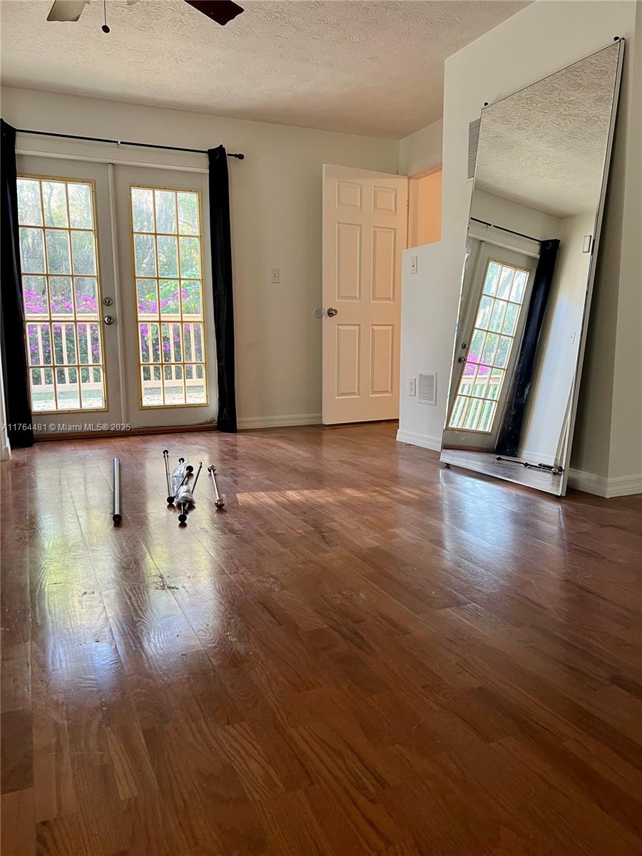 2985 Hilltop Road St. Augustine, FL 32086 - Photo 21 of 26 a view of an empty room with wooden floor and a window