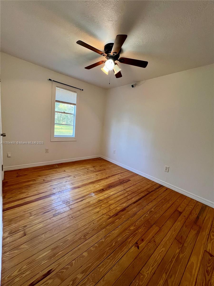 2985 Hilltop Road St. Augustine, FL 32086 - Photo 23 of 26 wooden floor in an empty room
