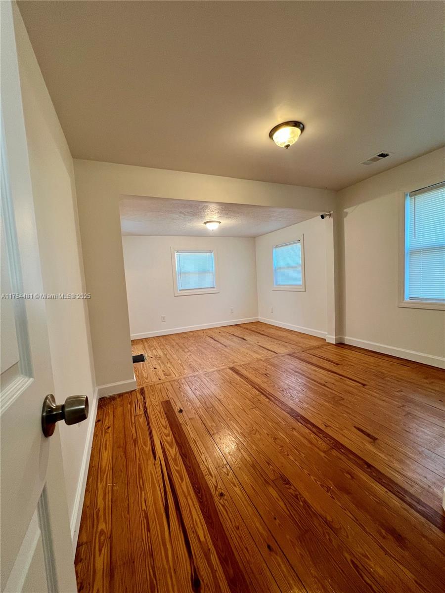 2985 Hilltop Road St. Augustine, FL 32086 - Photo 24 of 26 a view of a room with wooden floor and staircase