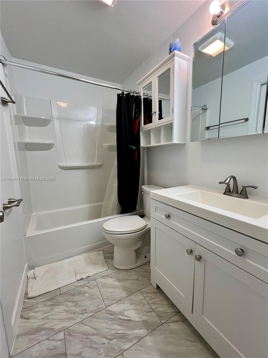 2985 Hilltop Road St. Augustine, FL 32086 - Photo 25 of 26 a bathroom with a sink toilet and shower
