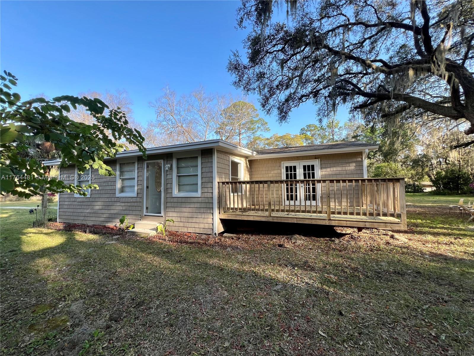 2985 Hilltop Road St. Augustine, FL 32086 - Photo 3 of 26 a front view of a house with a yard