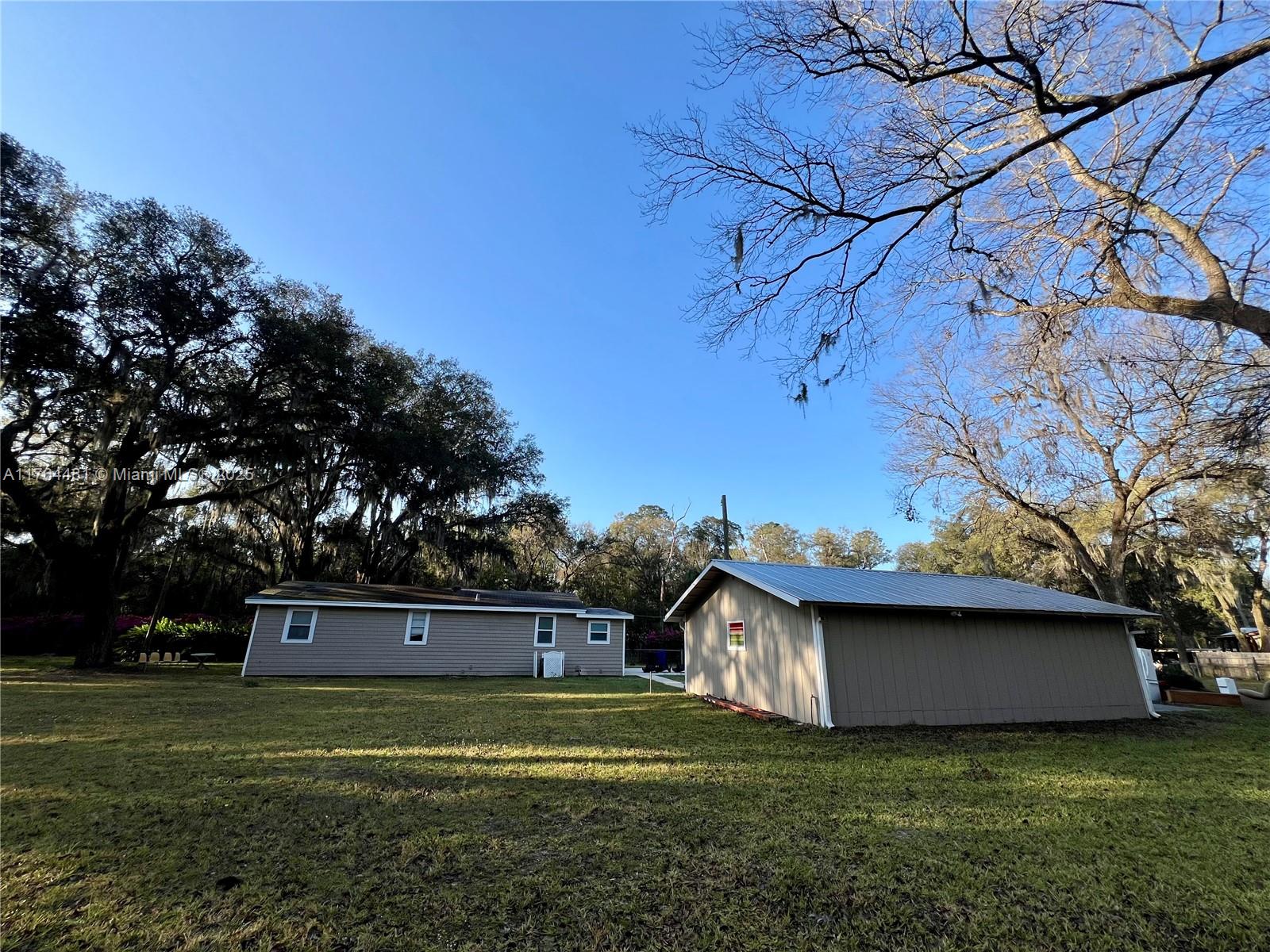 2985 Hilltop Road St. Augustine, FL 32086 - Photo 6 of 26 a view of a house with a yard