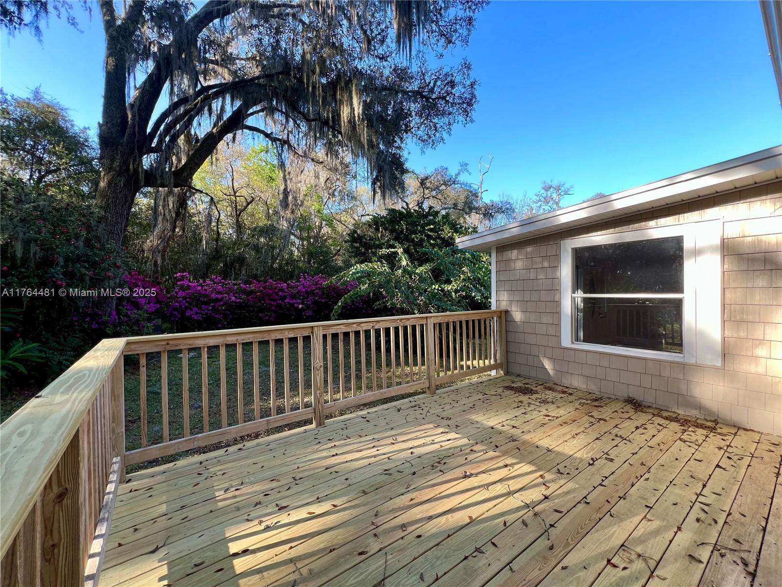 2985 Hilltop Road St. Augustine, FL 32086 - Photo 8 of 26 a view of backyard with a deck