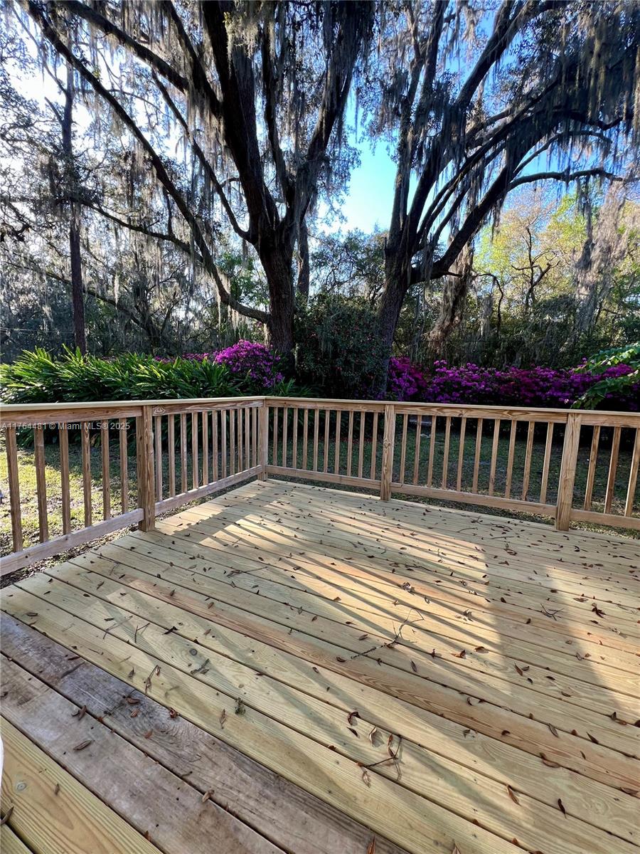 2985 Hilltop Road St. Augustine, FL 32086 - Photo 9 of 26 a view of wooden deck and a yard