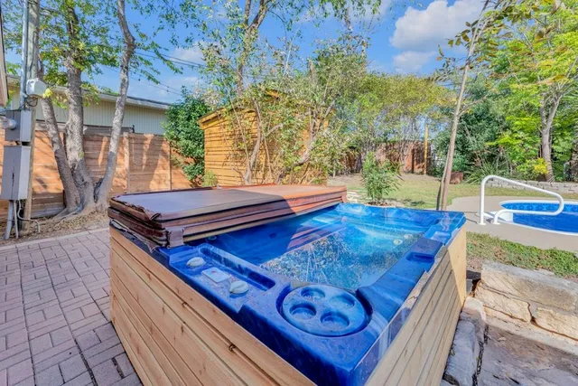 a view of a wooden deck with chairs