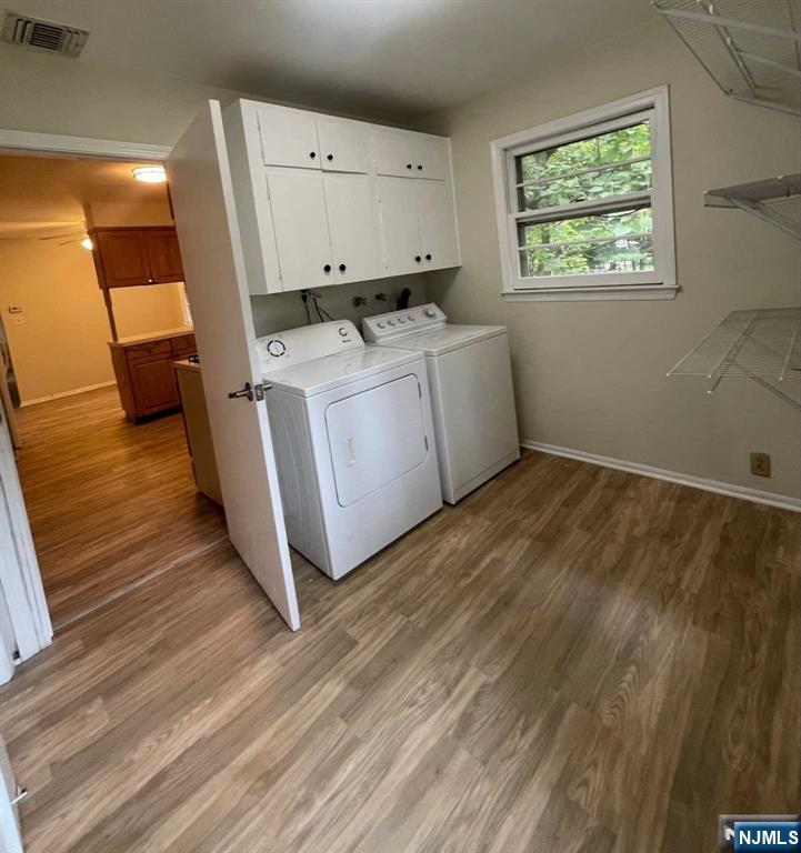 338 Queens Court Ridgewood, NJ 07450 - Photo 13 of 25 a utility room with wooden floor washer and dryer