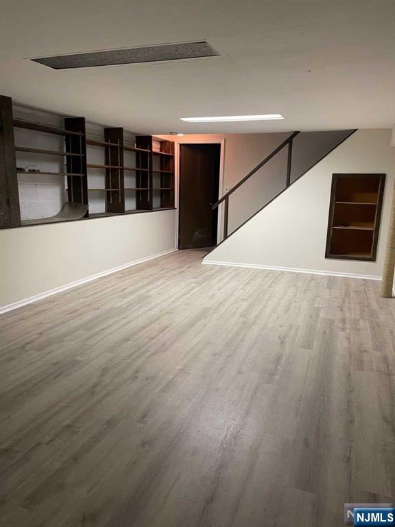 338 Queens Court Ridgewood, NJ 07450 - Photo 25 of 25 a view of an empty room with wooden floor