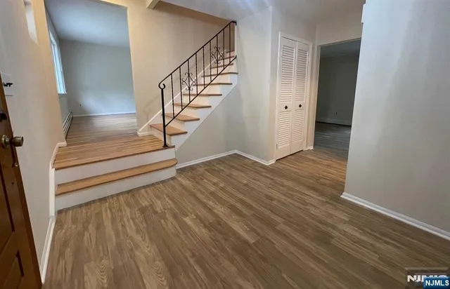 a view of entryway with wooden floor