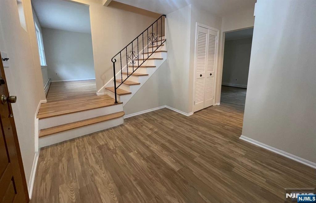 338 Queens Court Ridgewood, NJ 07450 - Photo 4 of 25 a view of entryway with wooden floor