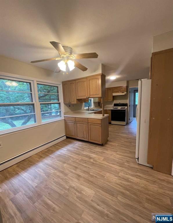 338 Queens Court Ridgewood, NJ 07450 - Photo 10 of 25 a living room with furniture and a fireplace