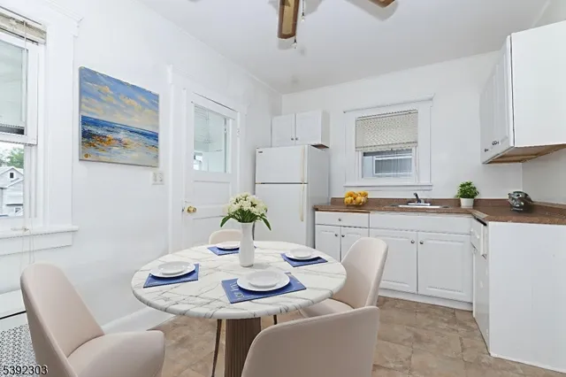 a open dining room with furniture and window