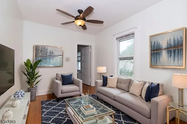 a living room with furniture and a rug