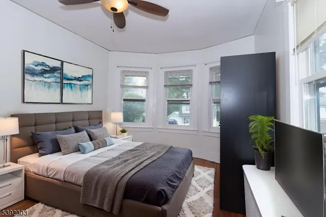 a bedroom with bed and window