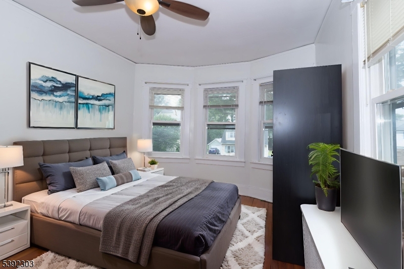 94 2nd Avenue Garwood, NJ 07027 - Photo 3 of 12 a bedroom with bed and window