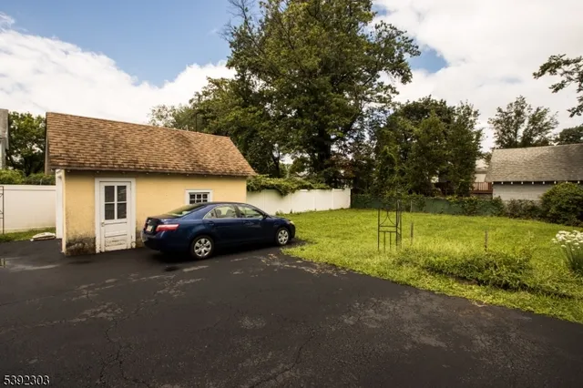 a view of a house with a street