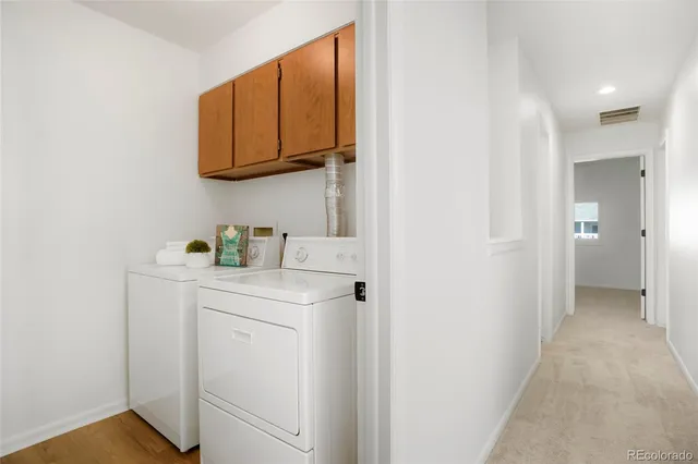 a view of a storage & utility room with washer and dryer