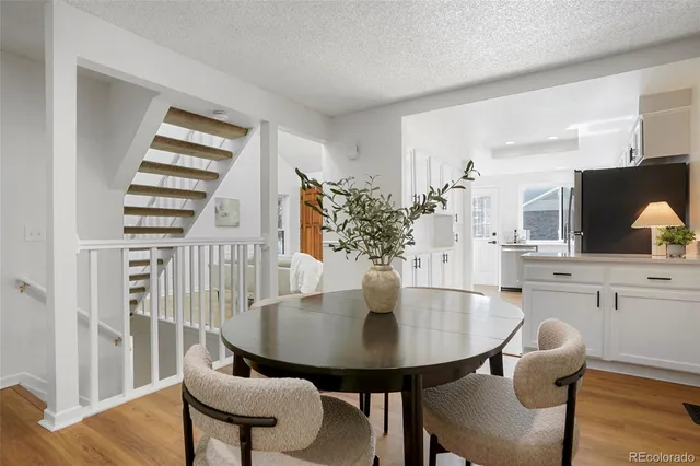 a kitchen with a table and chairs in it