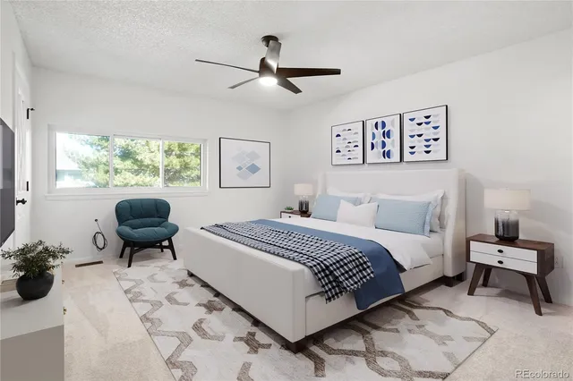 a bedroom with a bed and chair