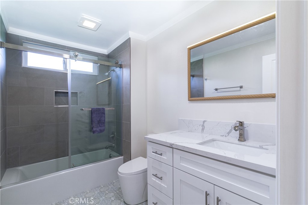 31 Windjammer Irvine, CA 92614 - Photo 13 of 31 a bathroom with a granite countertop sink a toilet and shower