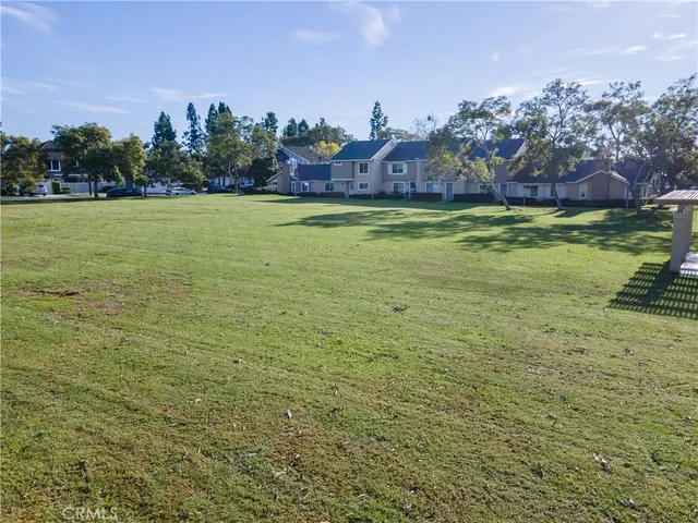 a view of a backyard with sitting area