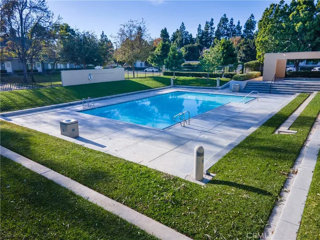 a view of a swimming pool with outdoor seating