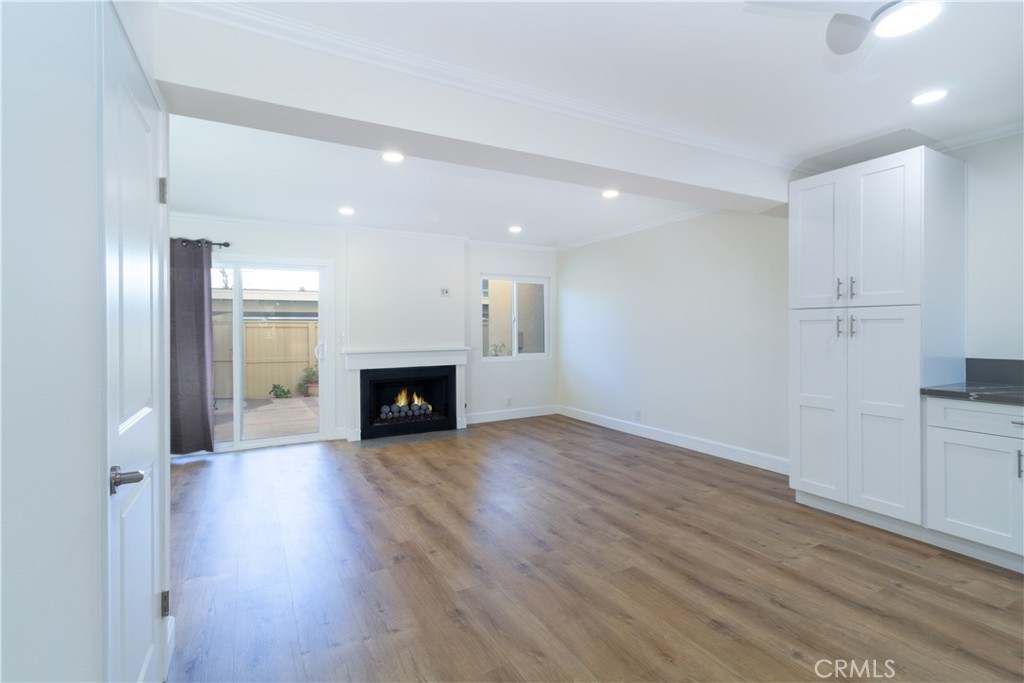 31 Windjammer Irvine, CA 92614 - Photo 5 of 31 an empty room with wooden floor fireplace and windows
