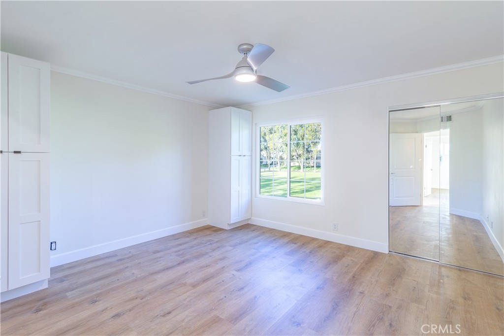 31 Windjammer Irvine, CA 92614 - Photo 7 of 31 an empty room with wooden floor and windows
