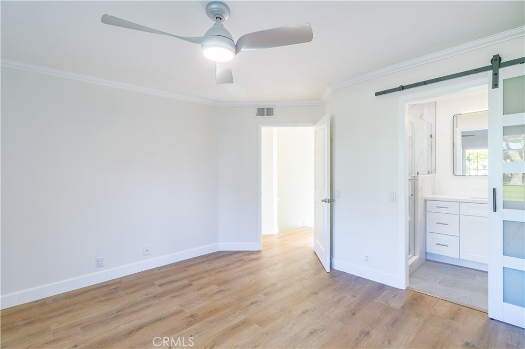 31 Windjammer Irvine, CA 92614 - Photo 8 of 31 an empty room with wooden floor cabinet and windows