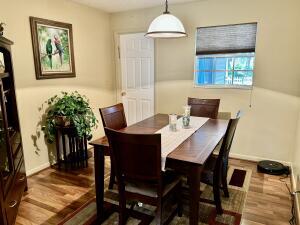 1515 Southwest 19th Terrace Okeechobee, FL 34974 - Photo 14 of 39 a view of a dining room with furniture window and wooden floor