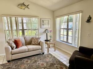 1515 Southwest 19th Terrace Okeechobee, FL 34974 - Photo 21 of 39 a living room with furniture and a window