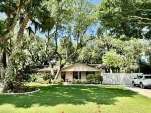 1515 Southwest 19th Terrace Okeechobee, FL 34974 - Photo 24 of 39 a view of a house with a yard and sitting area