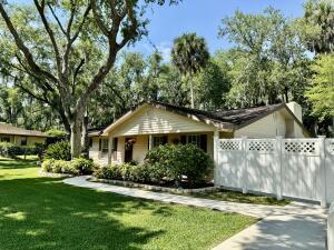 1515 Southwest 19th Terrace Okeechobee, FL 34974 - Photo 28 of 39 a front view of a house with a yard