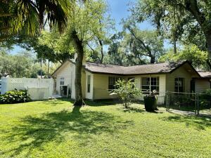 1515 Southwest 19th Terrace Okeechobee, FL 34974 - Photo 29 of 39 a view of a house with yard and a garden